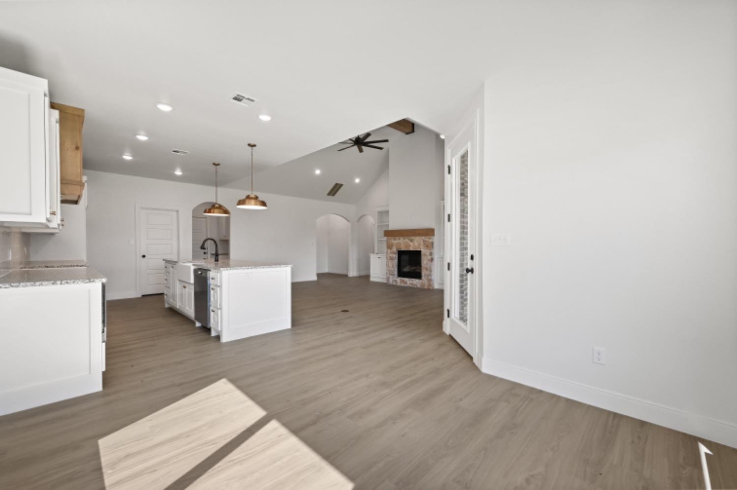 5607 119th Street Lubbock, TX 79424 - Photo 15 of 33 a view of kitchen with furniture and wooden floor