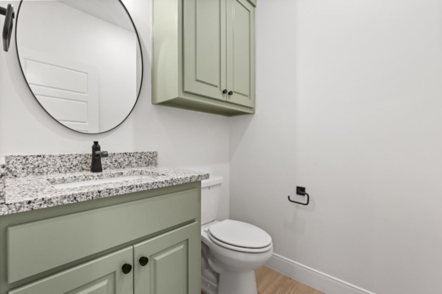 5607 119th Street Lubbock, TX 79424 - Photo 17 of 33 a bathroom with a granite countertop sink and a mirror