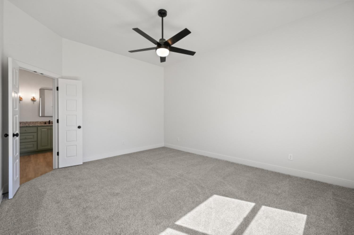 5607 119th Street Lubbock, TX 79424 - Photo 18 of 33 an empty room and chandelier fan in hallway
