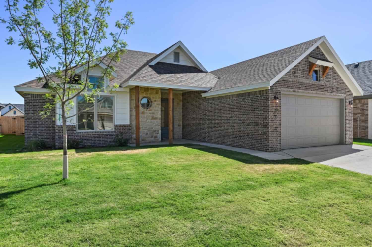 5607 119th Street Lubbock, TX 79424 - Photo 2 of 33 front view of a house with a yard