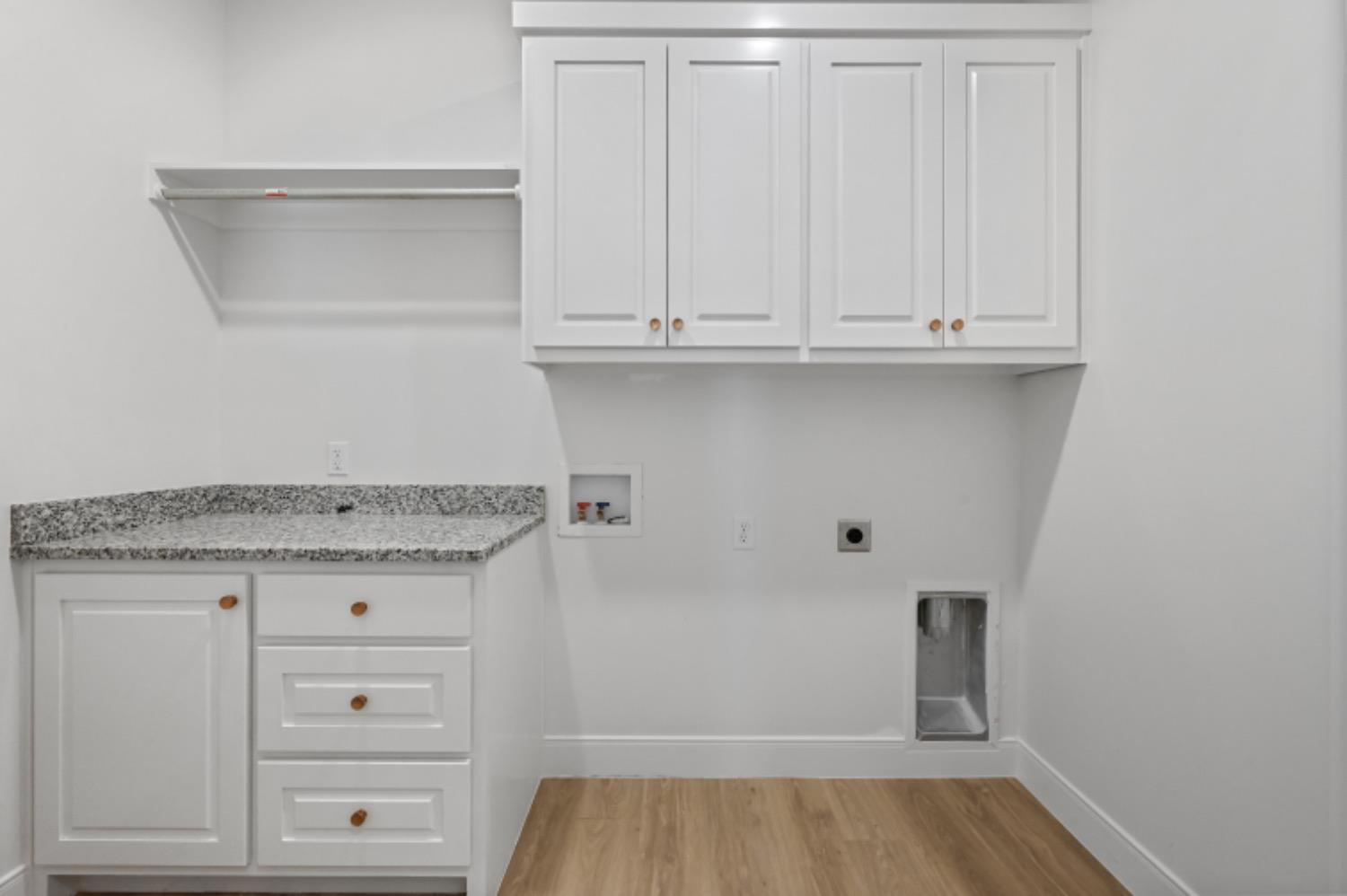 5607 119th Street Lubbock, TX 79424 - Photo 25 of 33 a view of cabinets with wooden floor