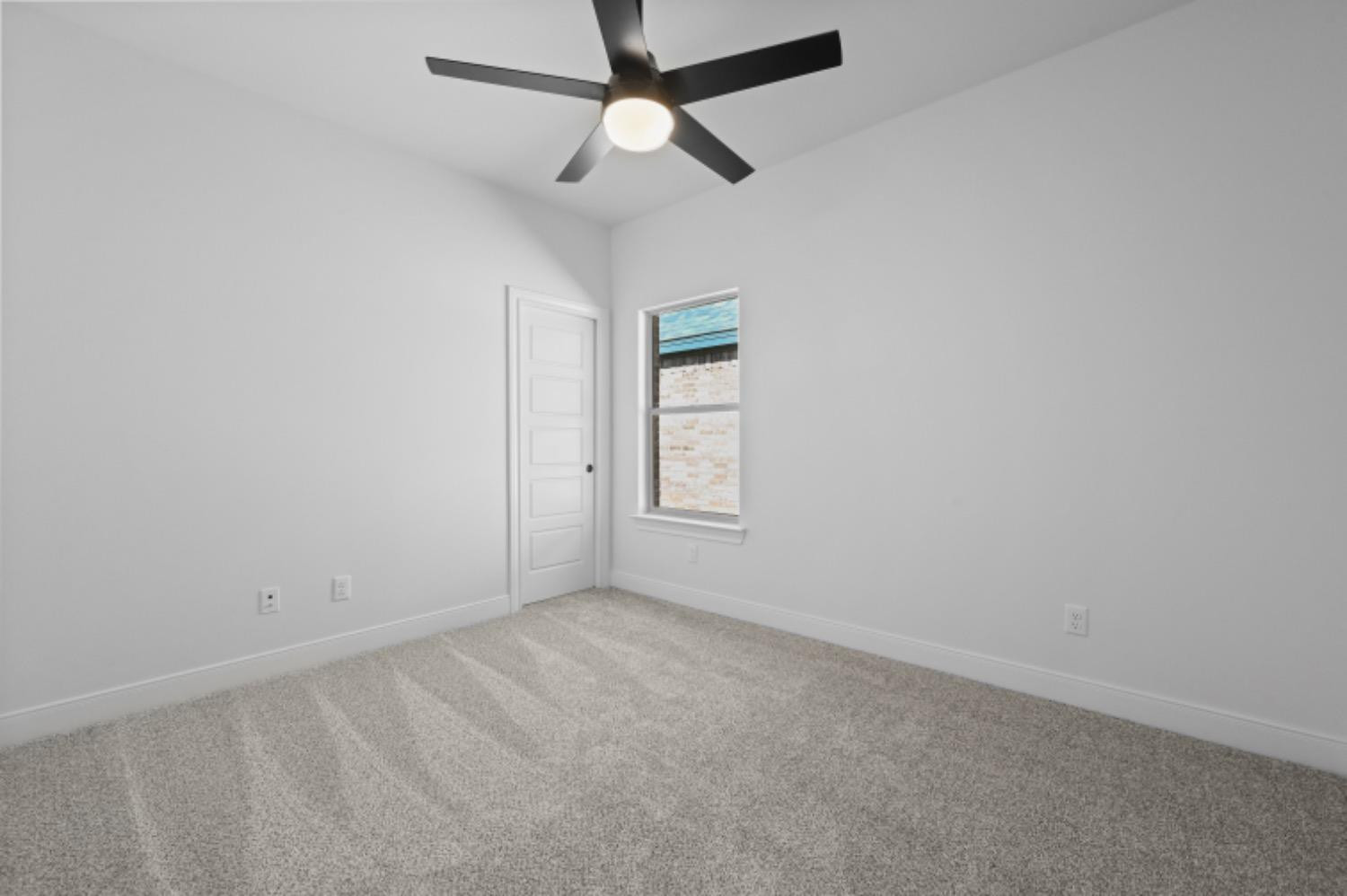 5607 119th Street Lubbock, TX 79424 - Photo 27 of 33 an empty room with a window and a fan