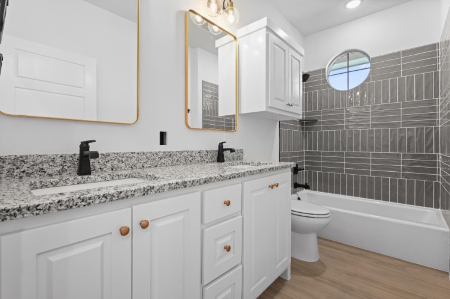 5607 119th Street Lubbock, TX 79424 - Photo 29 of 33 a bathroom with a granite countertop bathtub sink vanity mirror and toilet