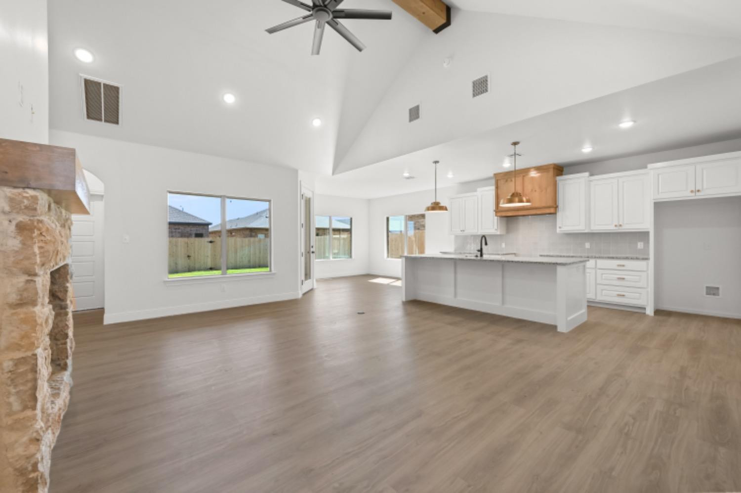 5607 119th Street Lubbock, TX 79424 - Photo 4 of 33 a view of kitchen with cabinets and wooden floor