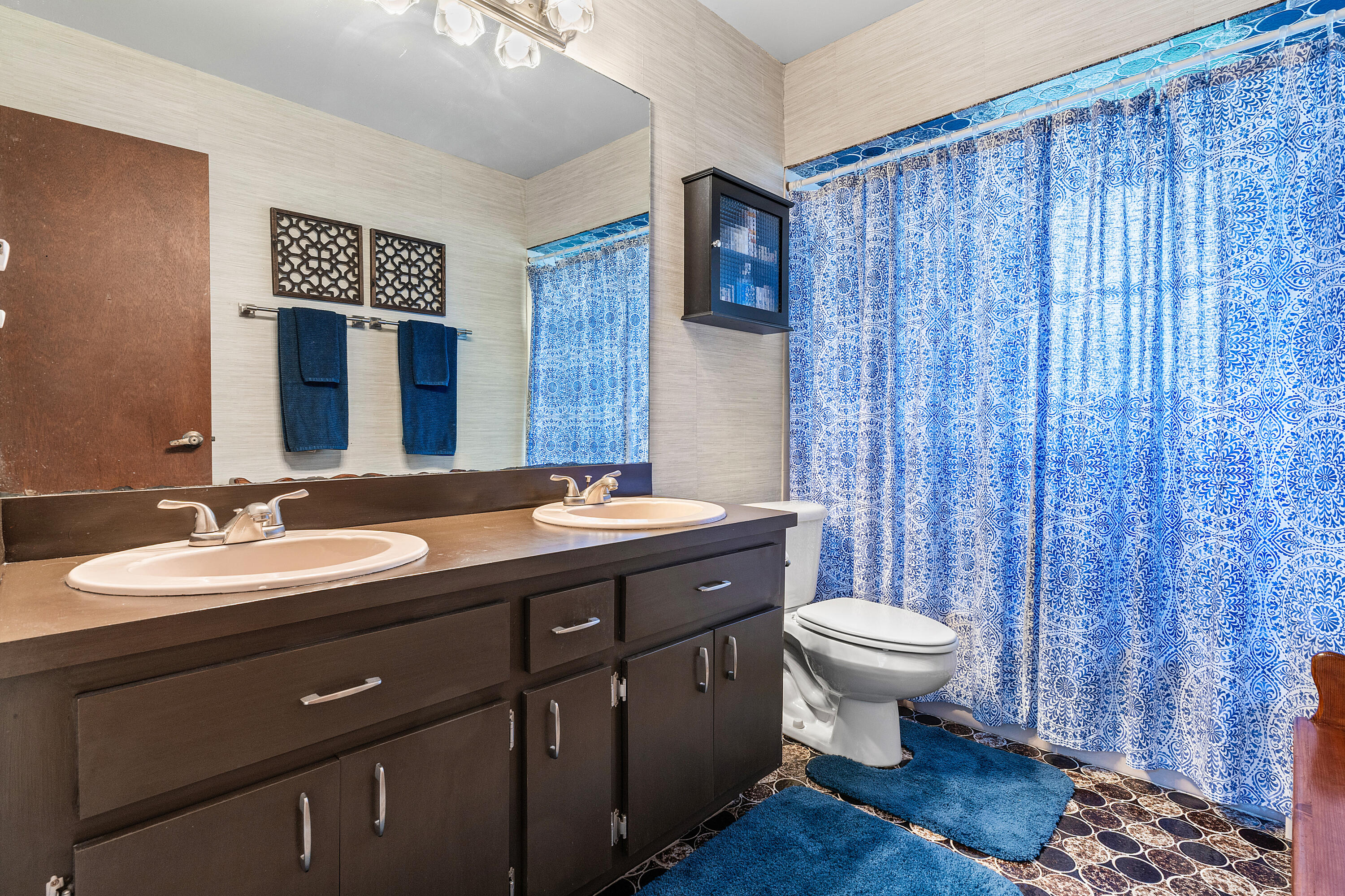 267 Old Country Road South Wellington, FL 33414 - Photo 14 of 22 a bathroom with a toilet sink and mirror