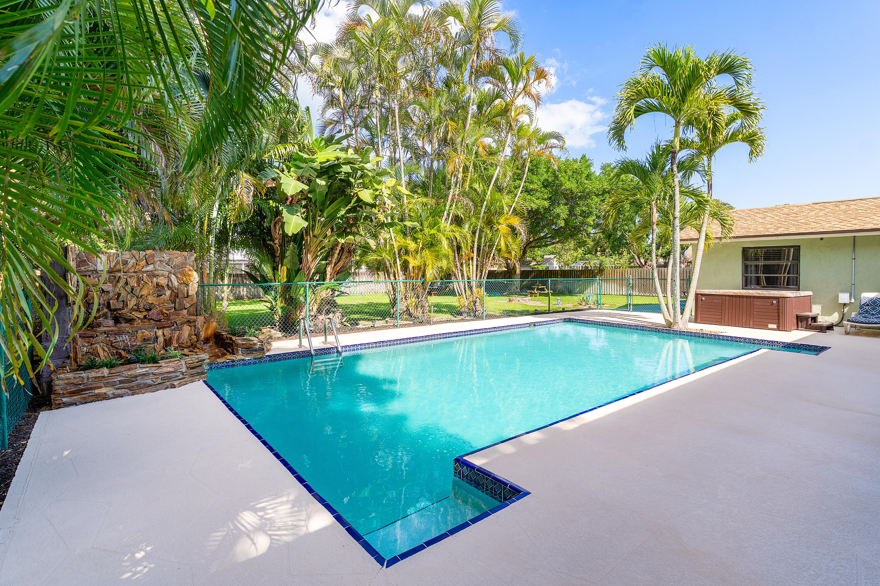 267 Old Country Road South Wellington, FL 33414 - Photo 18 of 22 a view of a swimming pool with a yard