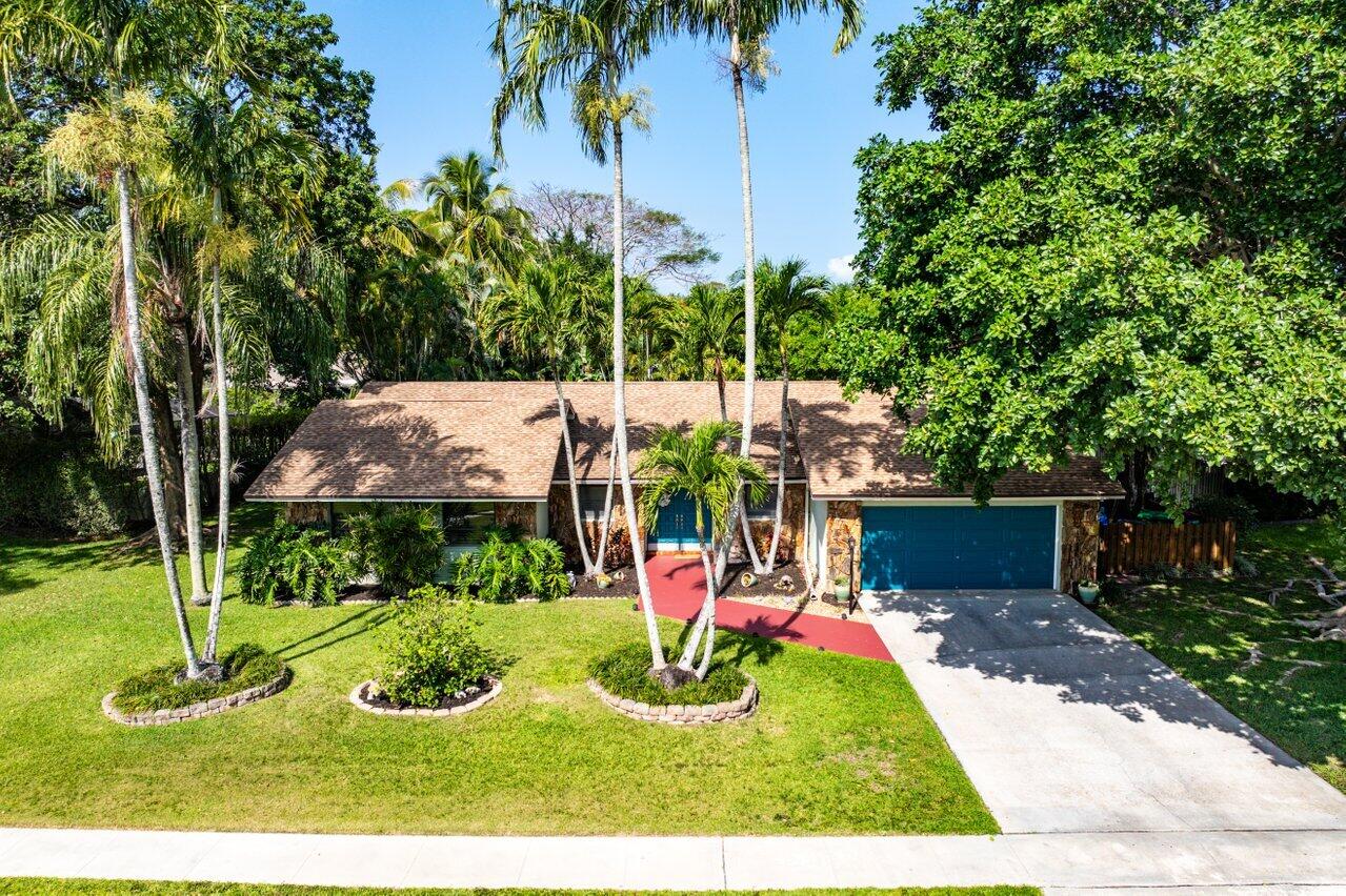 267 Old Country Road South Wellington, FL 33414 - Photo 2 of 22 a view of a park with large trees
