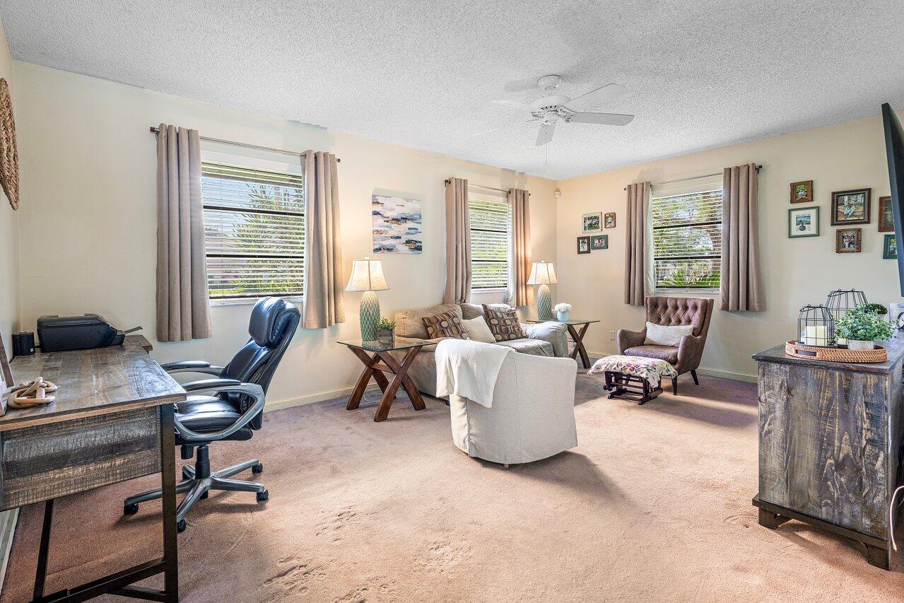 267 Old Country Road South Wellington, FL 33414 - Photo 3 of 22 a view of a livingroom with workspace and a window