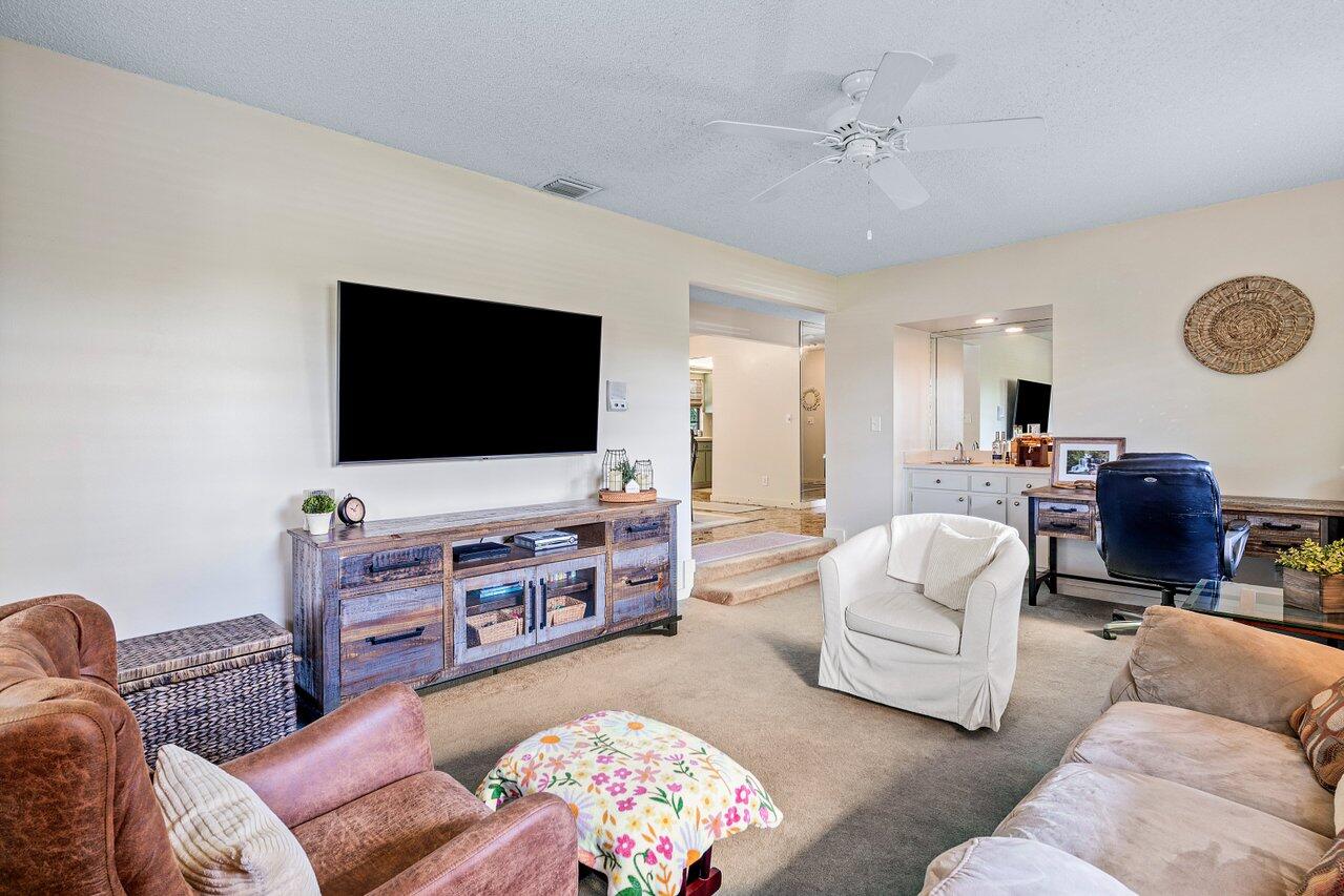 267 Old Country Road South Wellington, FL 33414 - Photo 4 of 22 a living room with furniture and a flat screen tv