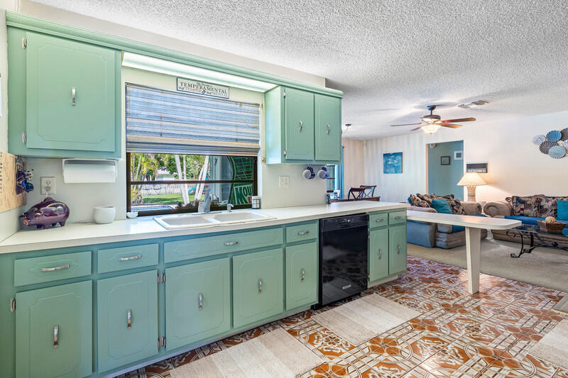267 Old Country Road South Wellington, FL 33414 - Photo 6 of 22 a kitchen with a sink cabinets and window