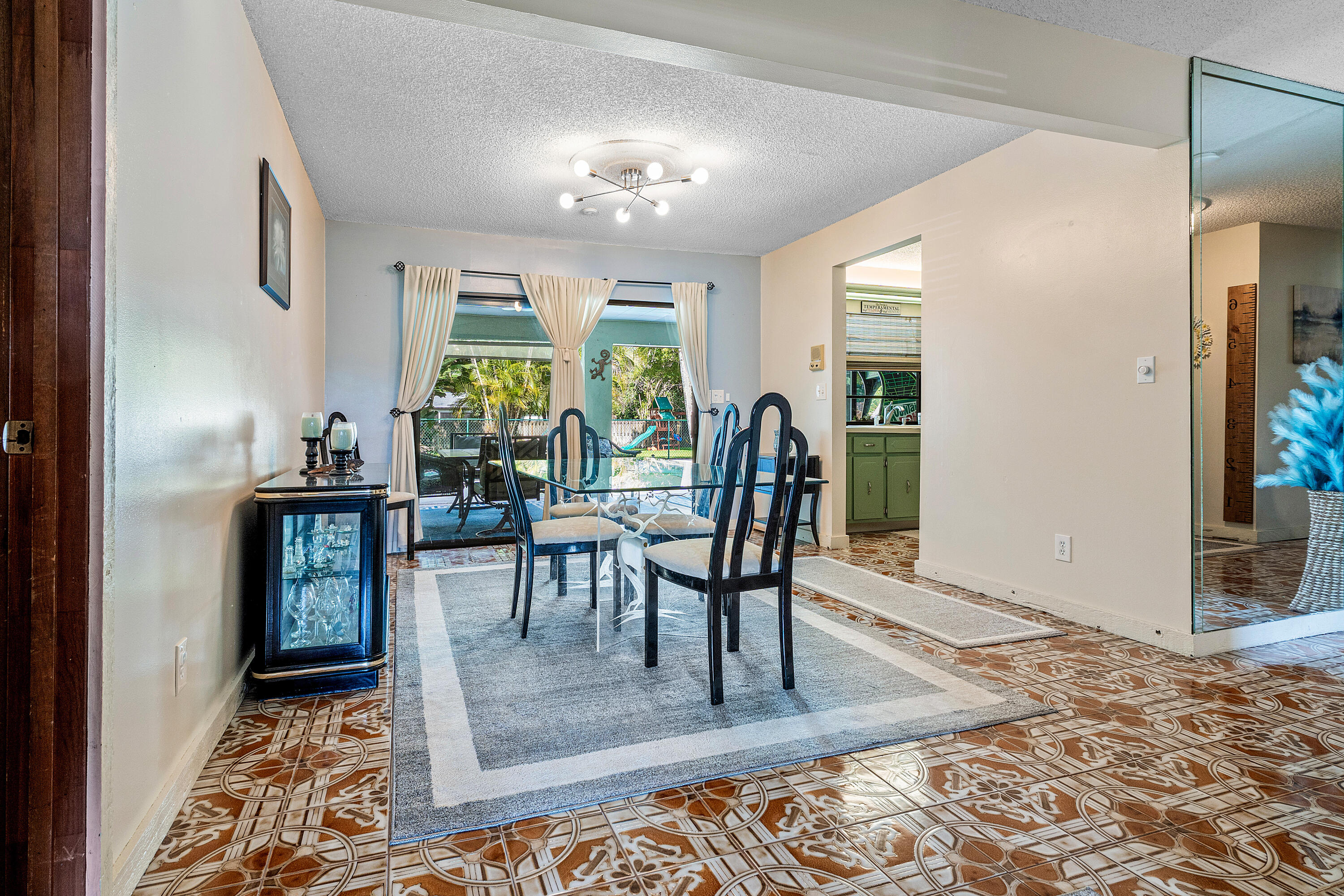 267 Old Country Road South Wellington, FL 33414 - Photo 8 of 22 a view of a dining room with furniture window and wooden floor