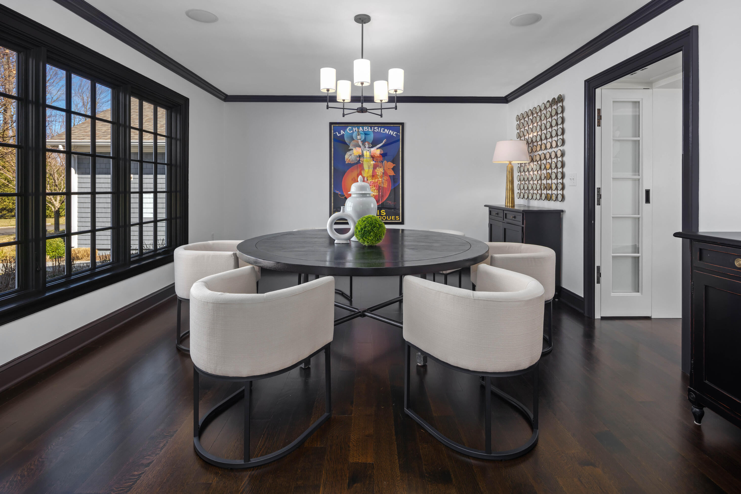 8 Hanson Road Darien, CT 06820 - Photo 15 of 38 a dining room with furniture a chandelier and wooden floor