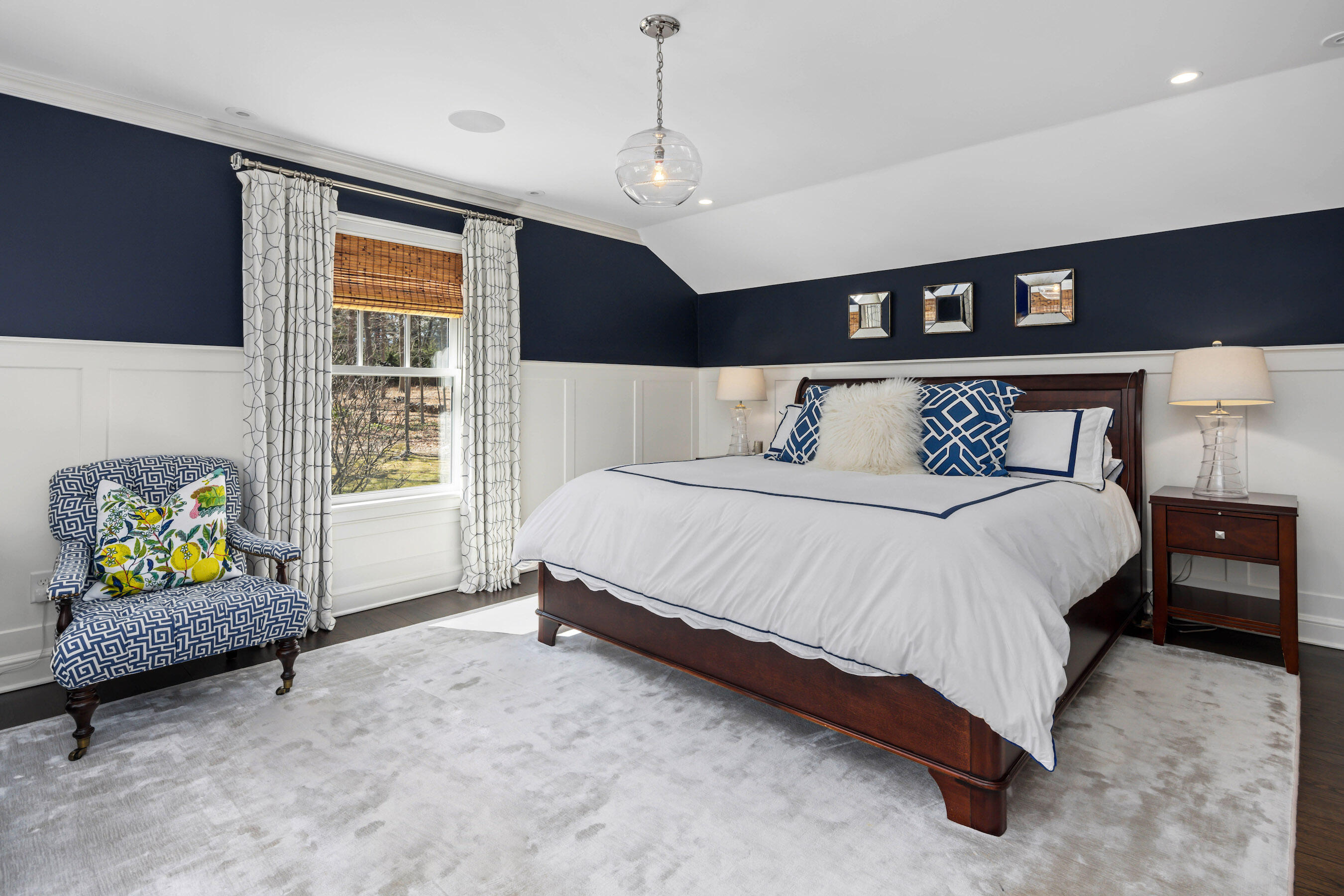 8 Hanson Road Darien, CT 06820 - Photo 16 of 38 a spacious bedroom with a bed a dresser and a window