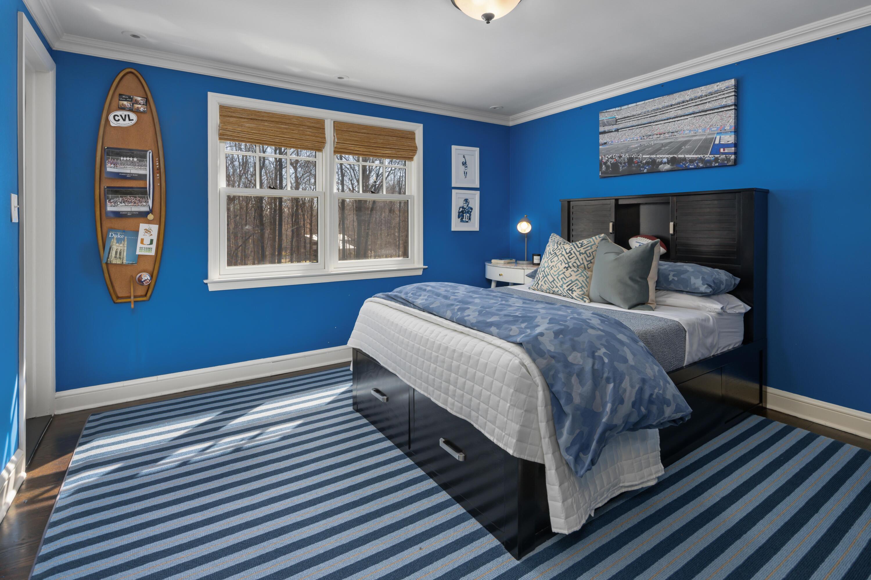 8 Hanson Road Darien, CT 06820 - Photo 20 of 38 a bedroom with a bed and wooden floor