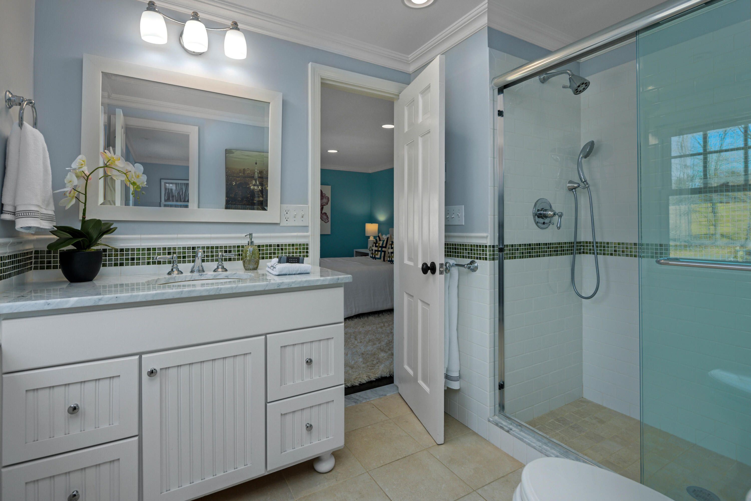 8 Hanson Road Darien, CT 06820 - Photo 24 of 38 a bathroom with a shower sink and mirror