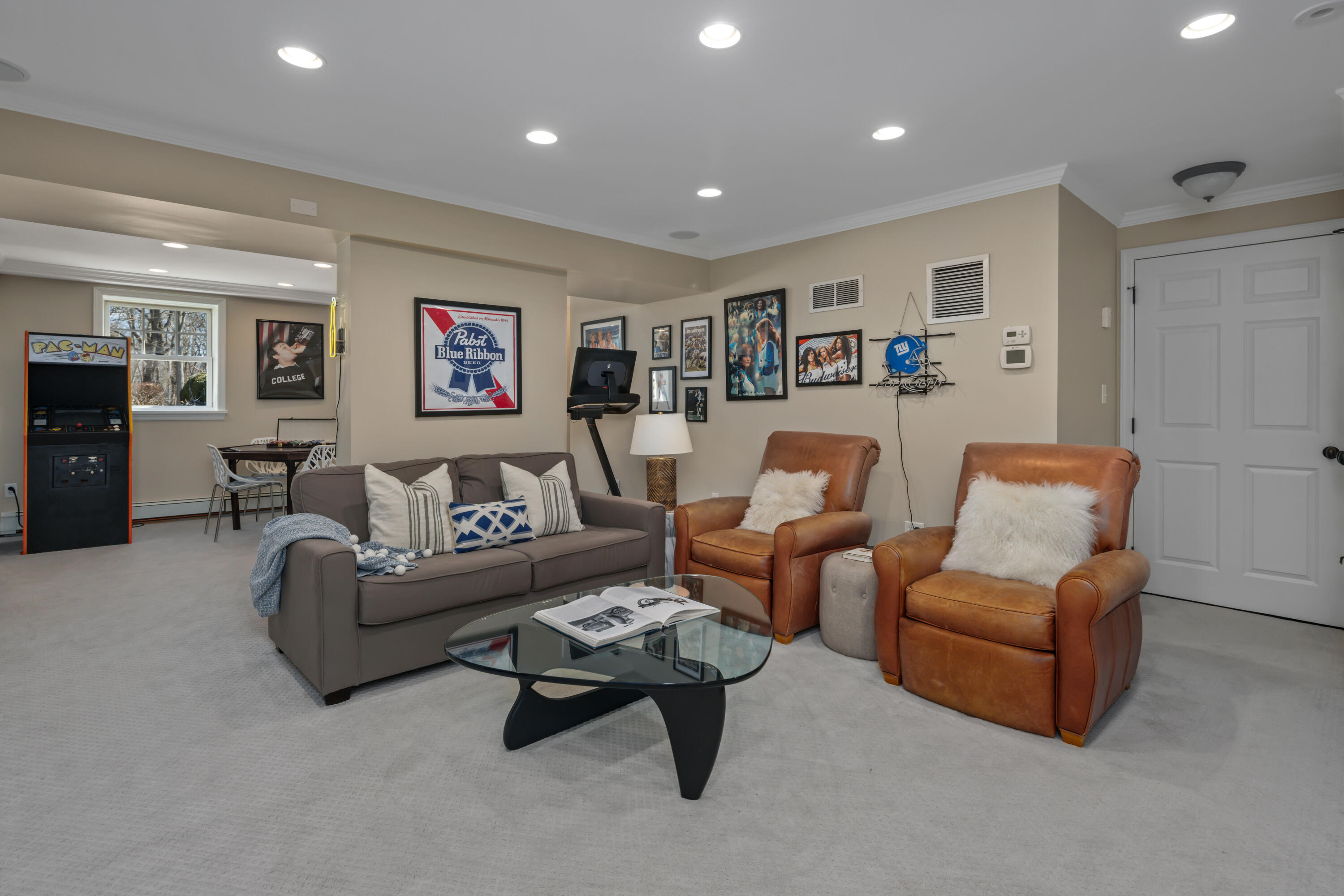 8 Hanson Road Darien, CT 06820 - Photo 27 of 38 a living room with furniture and wall paintings