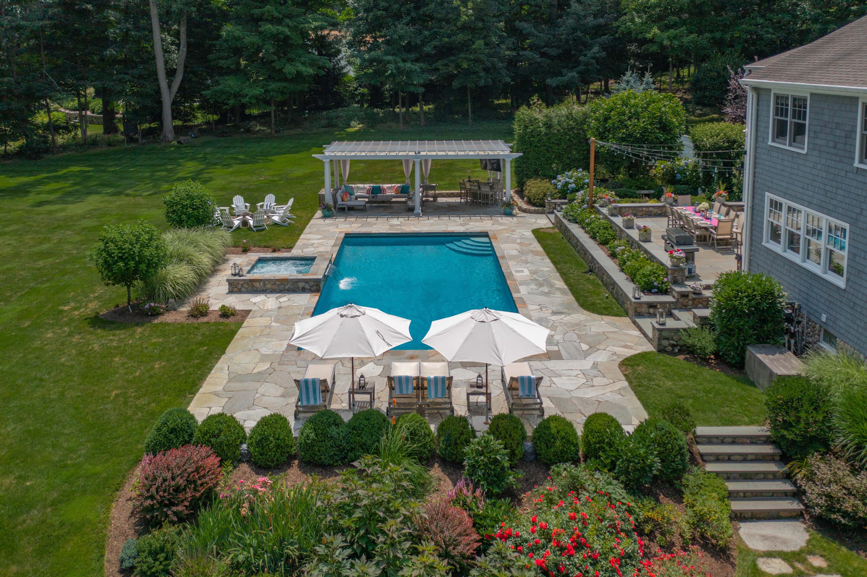 8 Hanson Road Darien, CT 06820 - Photo 3 of 38 a view of a swimming pool with a patio