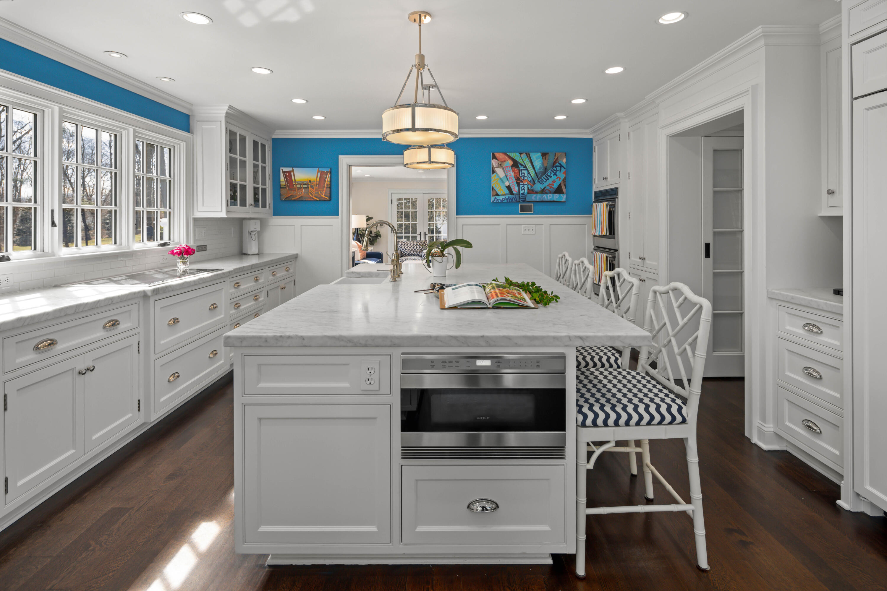 8 Hanson Road Darien, CT 06820 - Photo 6 of 38 a kitchen with stainless steel appliances a microwave a stove and white cabinets