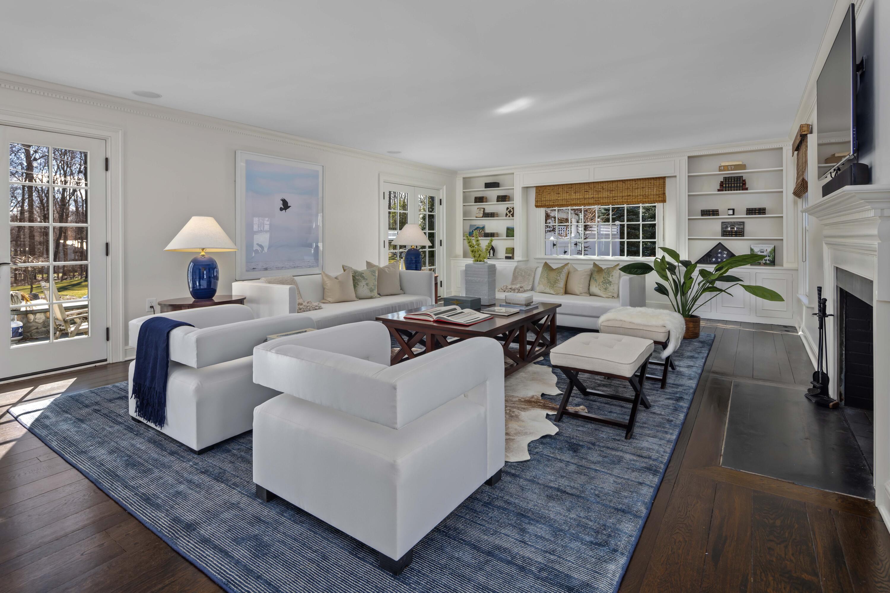 8 Hanson Road Darien, CT 06820 - Photo 8 of 38 a living room with fireplace furniture and a rug