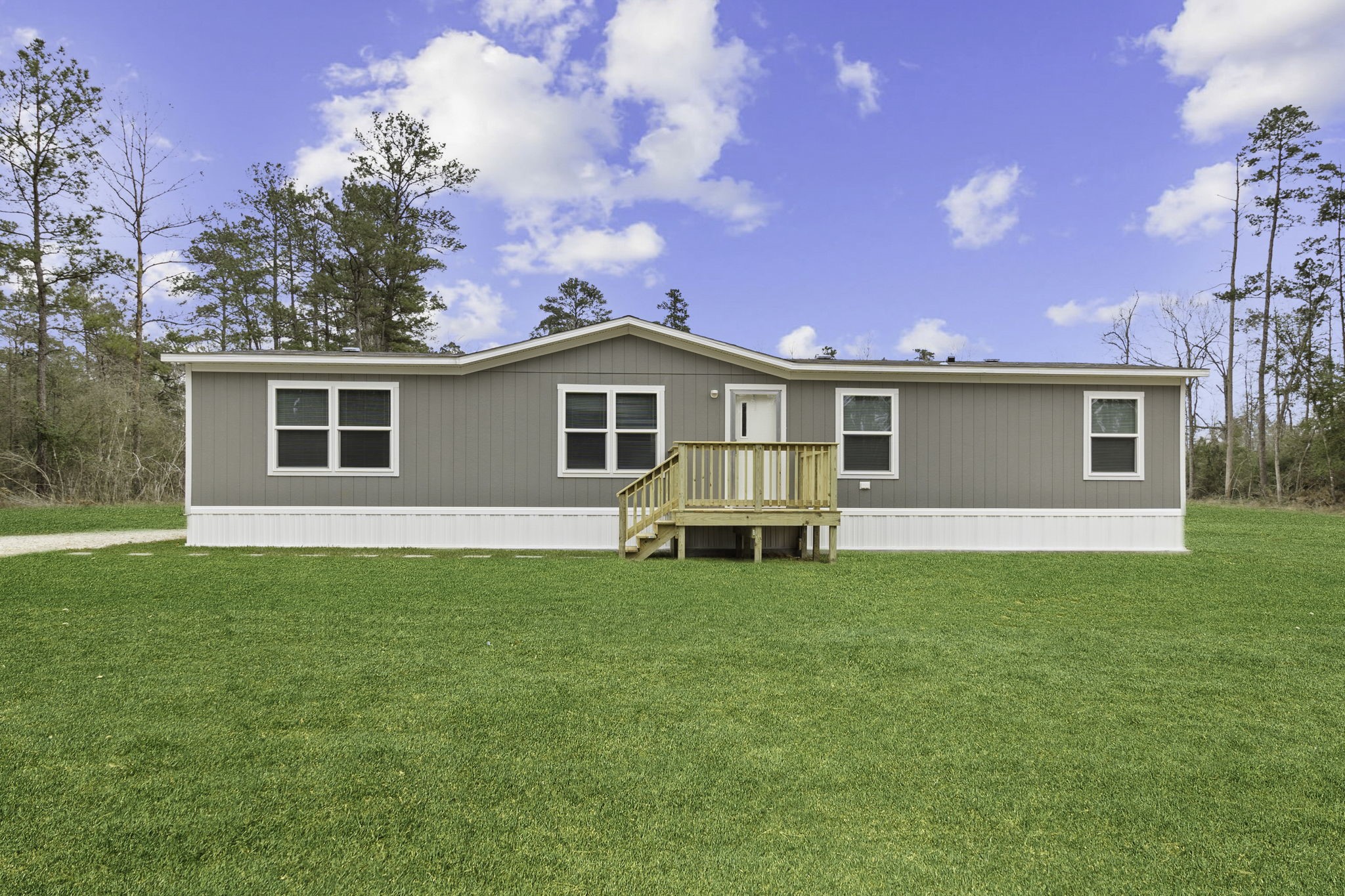 a view of a house with a backyard