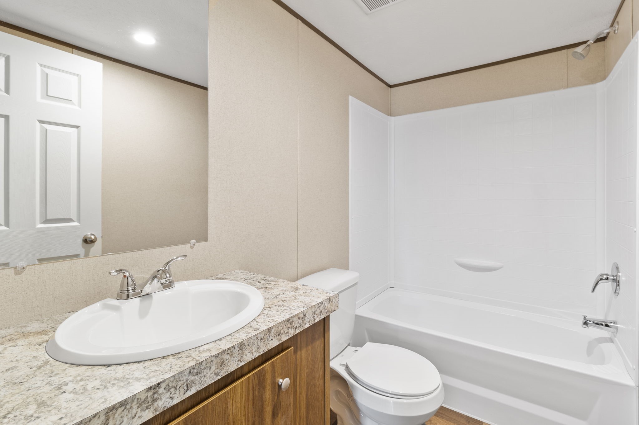 245 Rustic Way Livingston, TX 77351 - Photo 19 of 33 a bathroom with a granite countertop sink a toilet and shower