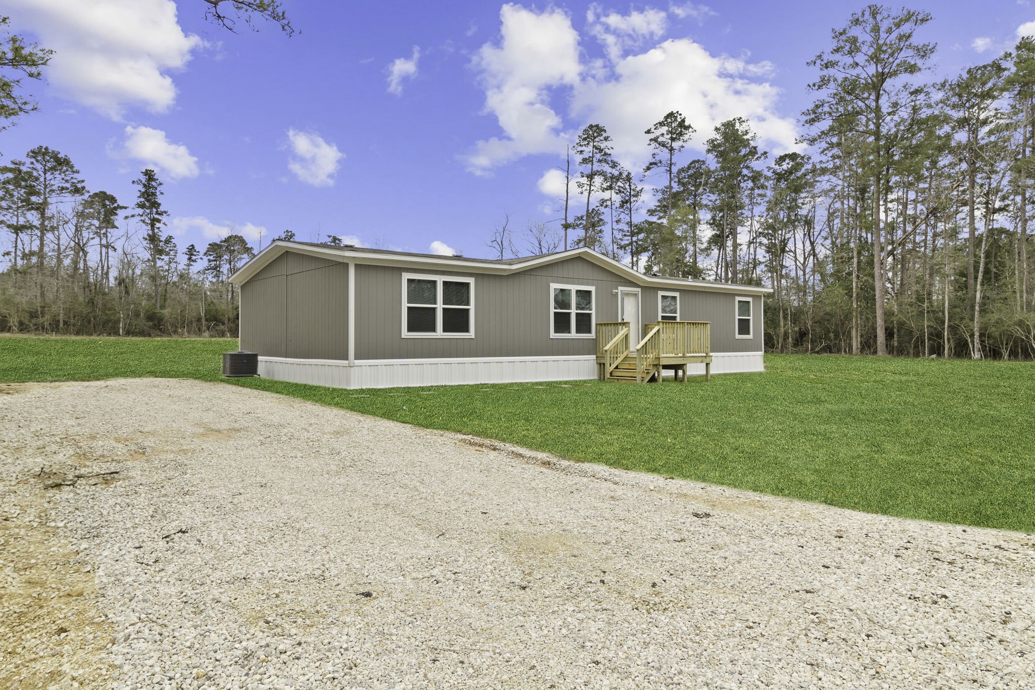 245 Rustic Way Livingston, TX 77351 - Photo 25 of 33 a front view of a house with garden