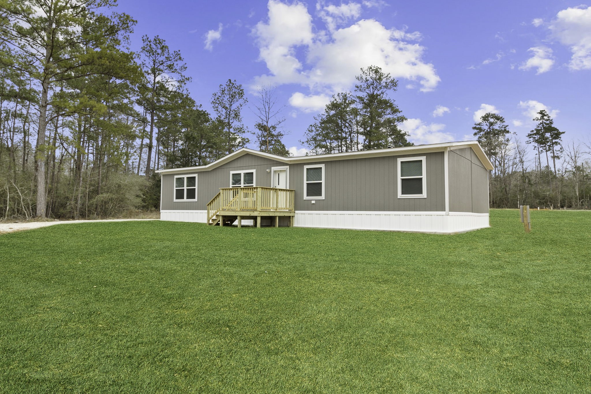 245 Rustic Way Livingston, TX 77351 - Photo 26 of 33 a front view of house with yard and green space