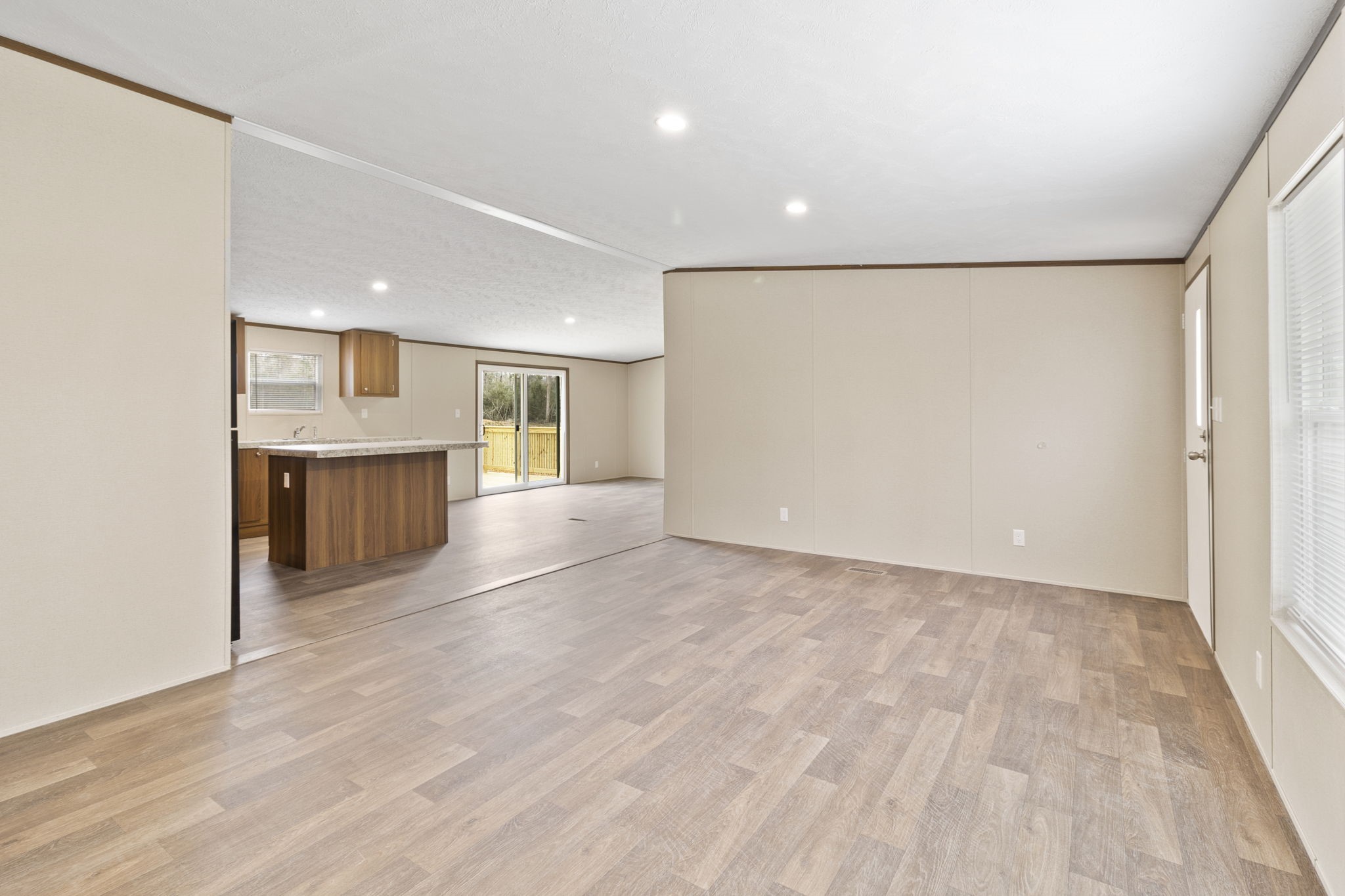 245 Rustic Way Livingston, TX 77351 - Photo 4 of 33 a view of a kitchen with a sink and a refrigerator