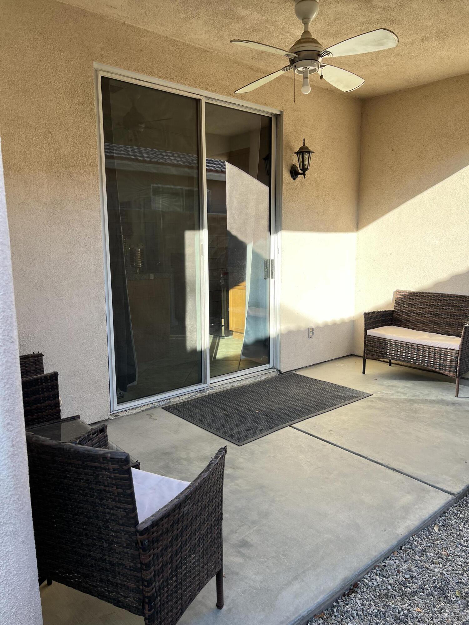 46450 Calle Raphael Indio, CA 92201 - Photo 27 of 33 a living room with a couch and a table