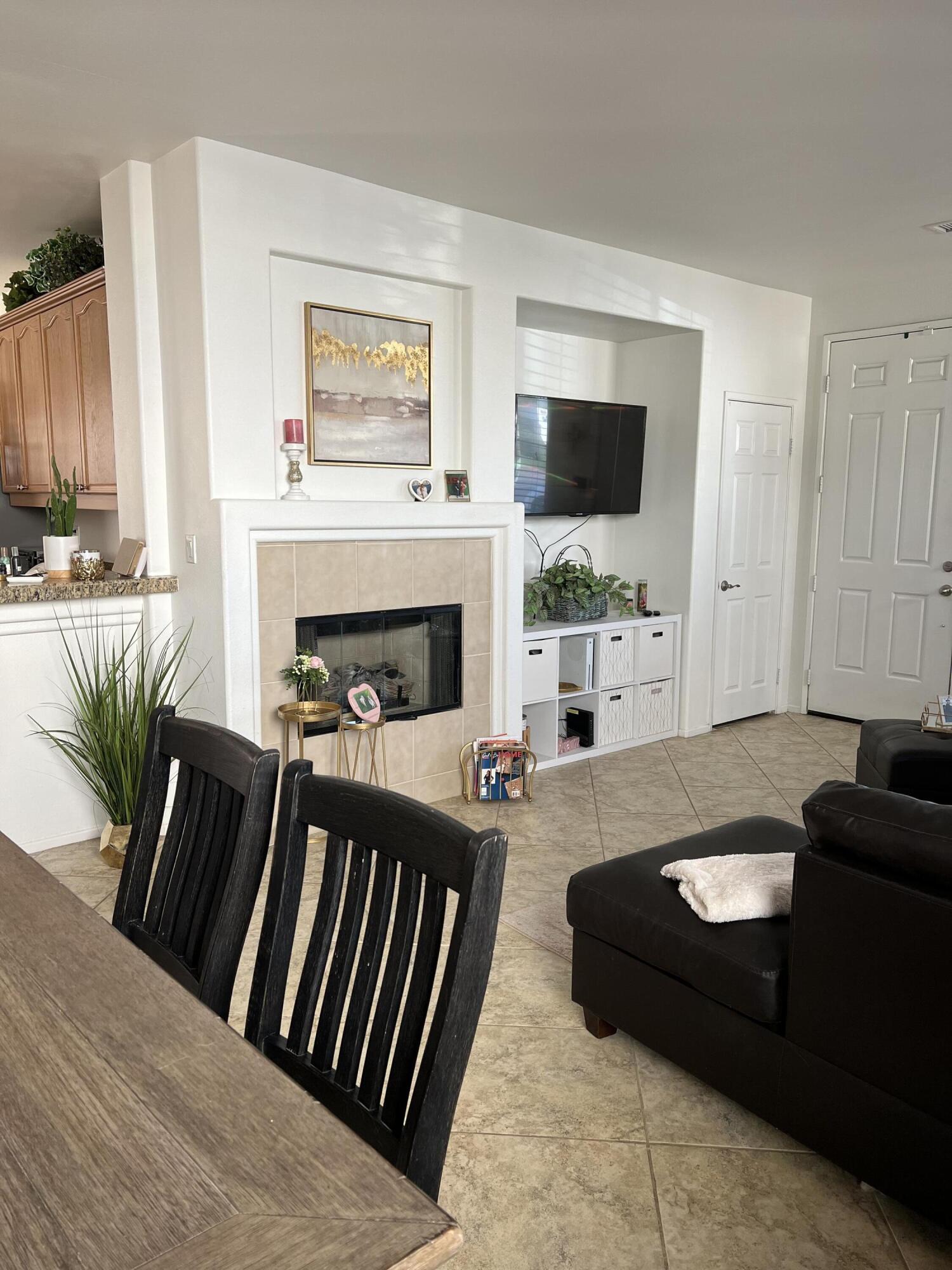 46450 Calle Raphael Indio, CA 92201 - Photo 5 of 33 a living room with furniture fireplace and window