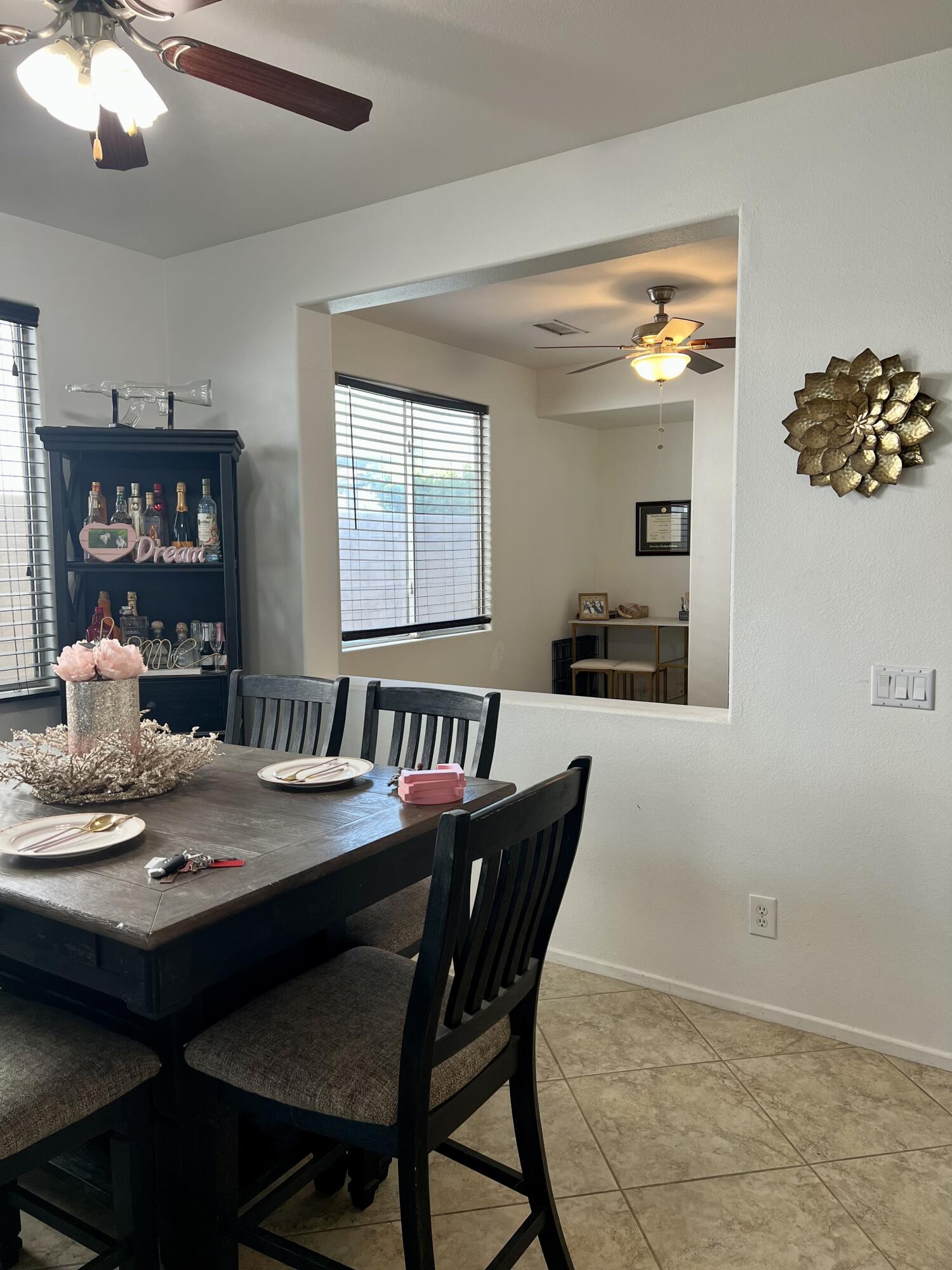 46450 Calle Raphael Indio, CA 92201 - Photo 8 of 33 a view of a dining room with furniture and chandelier