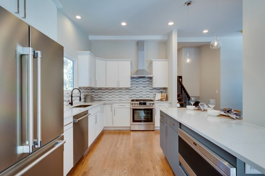 46 Turning Mill Road Lexington, MA 02420 - Photo 7 of 32 a kitchen with a sink stove and refrigerator