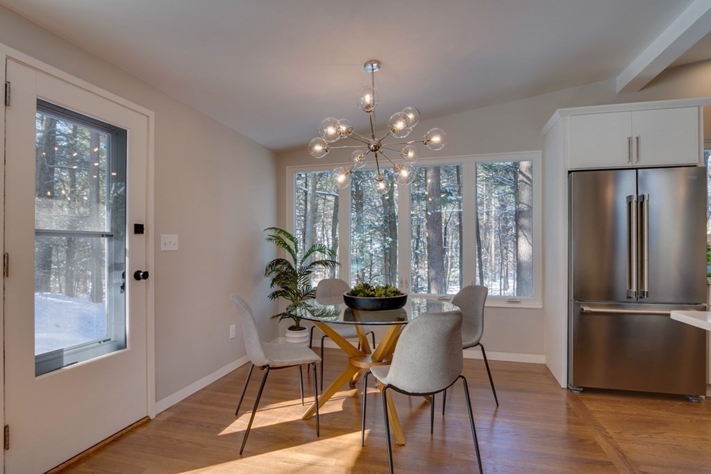 46 Turning Mill Road Lexington, MA 02420 - Photo 8 of 32 a view of a dining room with furniture window and wooden floor