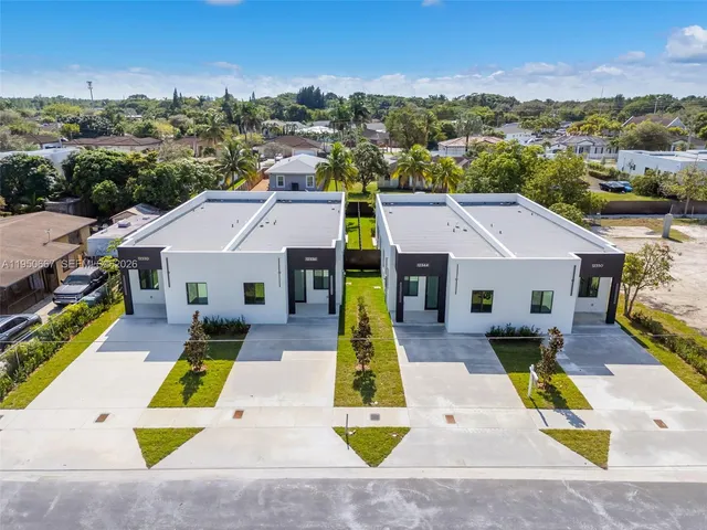 an aerial view of a house with swimming pool