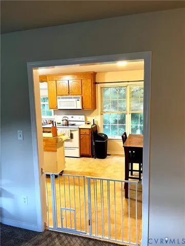 a view of a kitchen with a large window