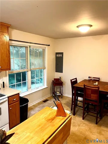 a room with furniture pool table and a flat screen tv