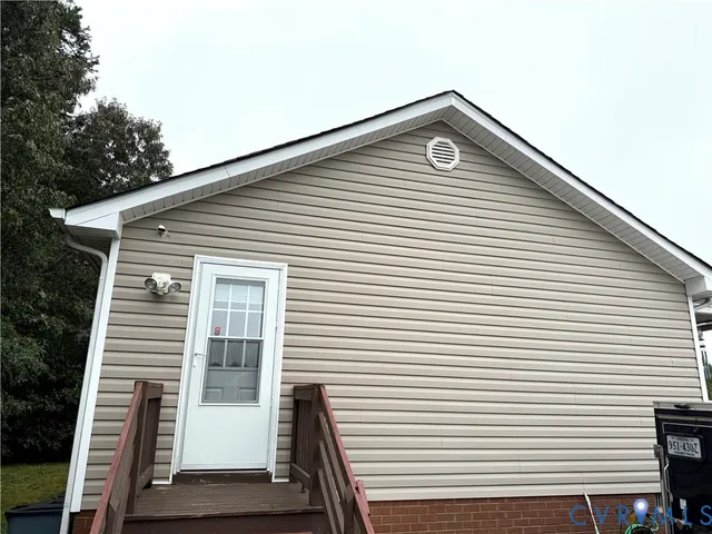 a front view of a house with a white door