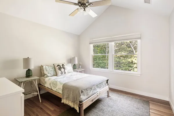 a bedroom with a bed and window
