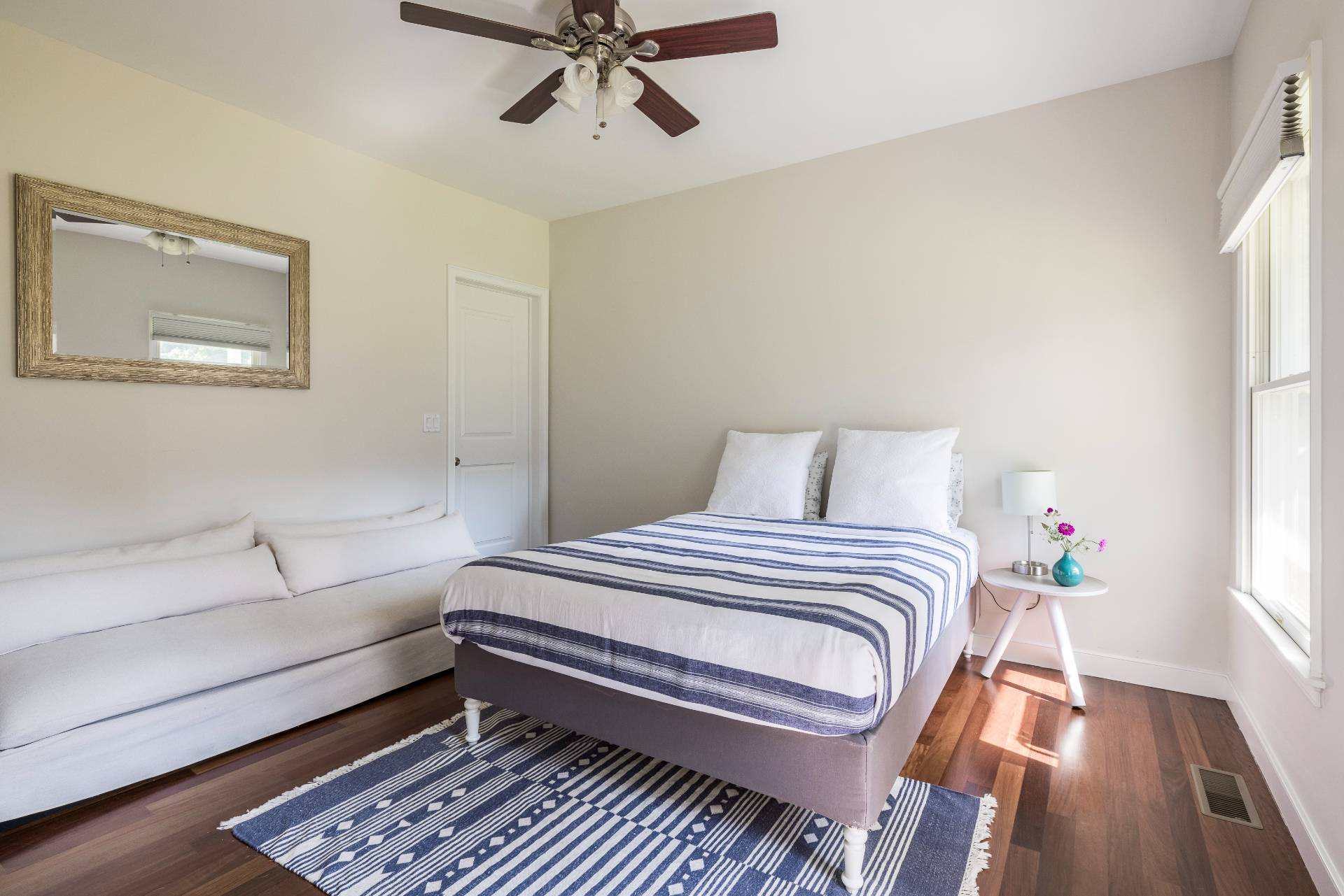 35 Glade Road East Hampton, NY 11937 - Photo 14 of 16 a bedroom with a bed and wooden floor