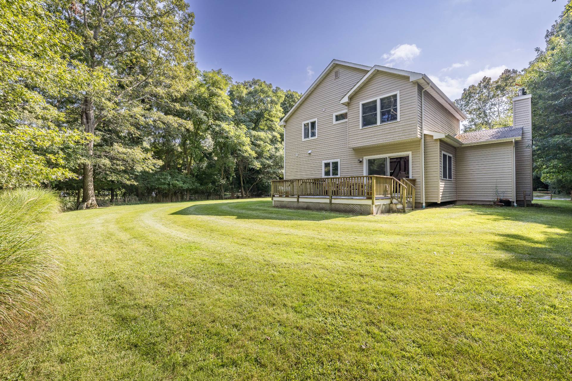 35 Glade Road East Hampton, NY 11937 - Photo 3 of 16 a house view with swimming pool and garden space
