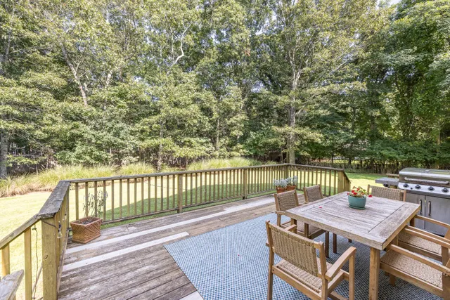 a view of a patio with wooden floor