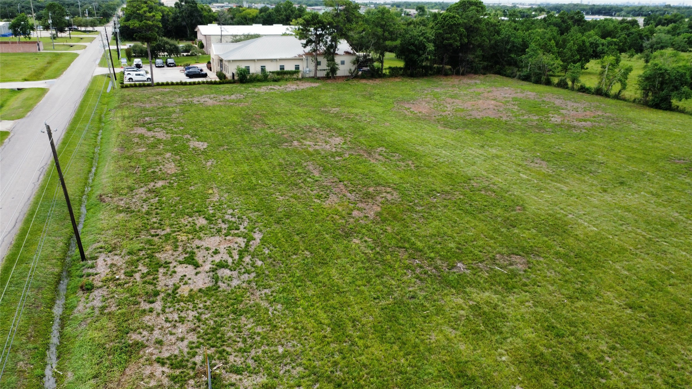 3759 Knapp Road Pearland, TX 77581 - Photo 4 of 8 a view of a garden with a building in the background