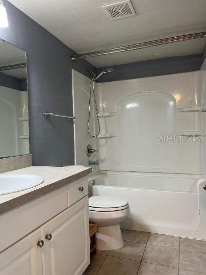 501 Southwest 75th Street, Unit H12 Gainesville, FL 32607 - Photo 7 of 10 a bathroom with a shower a sink and toilet