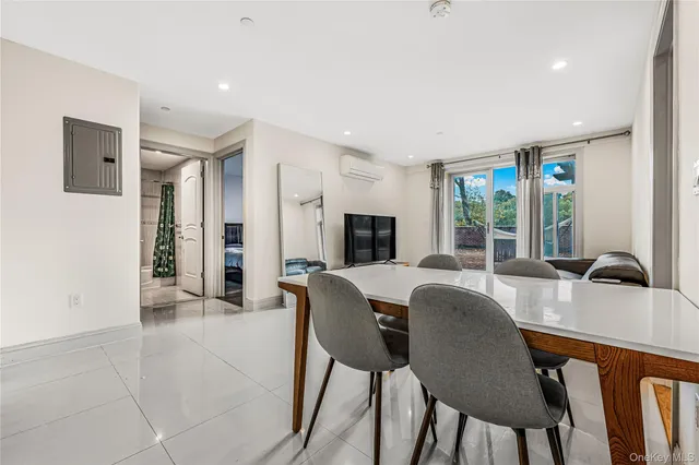 a view of a dining room with furniture window and outside view
