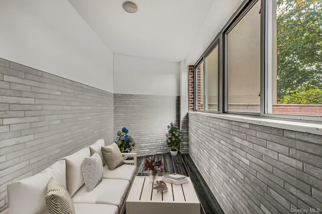 a view of a balcony with furniture