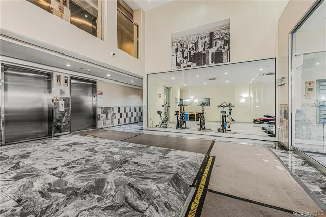 a large room with gym equipment