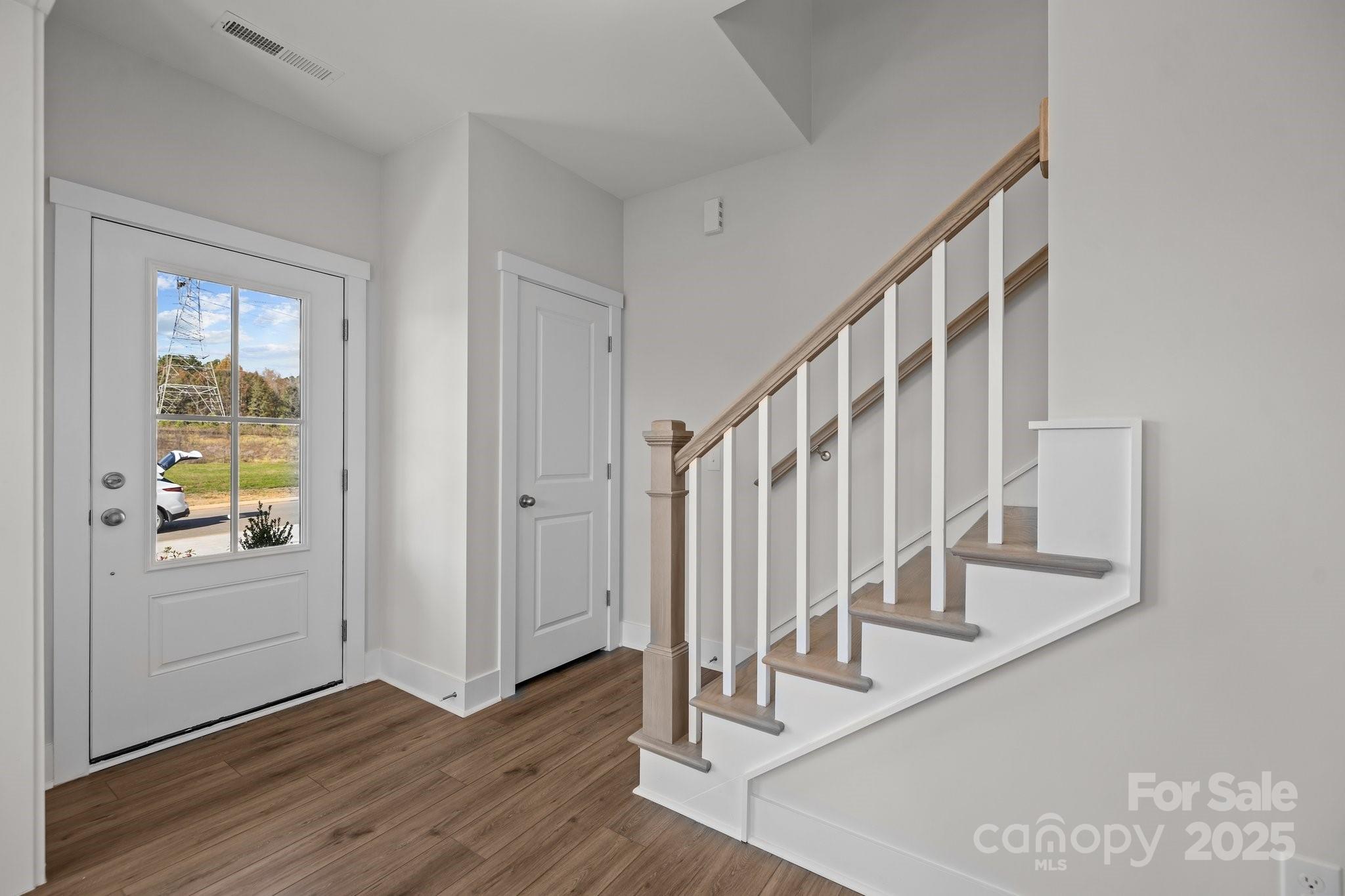 733 Sirius Lane, Unit 92 York, SC 29745 - Photo 2 of 18 a view of entryway with wooden floor and stairs