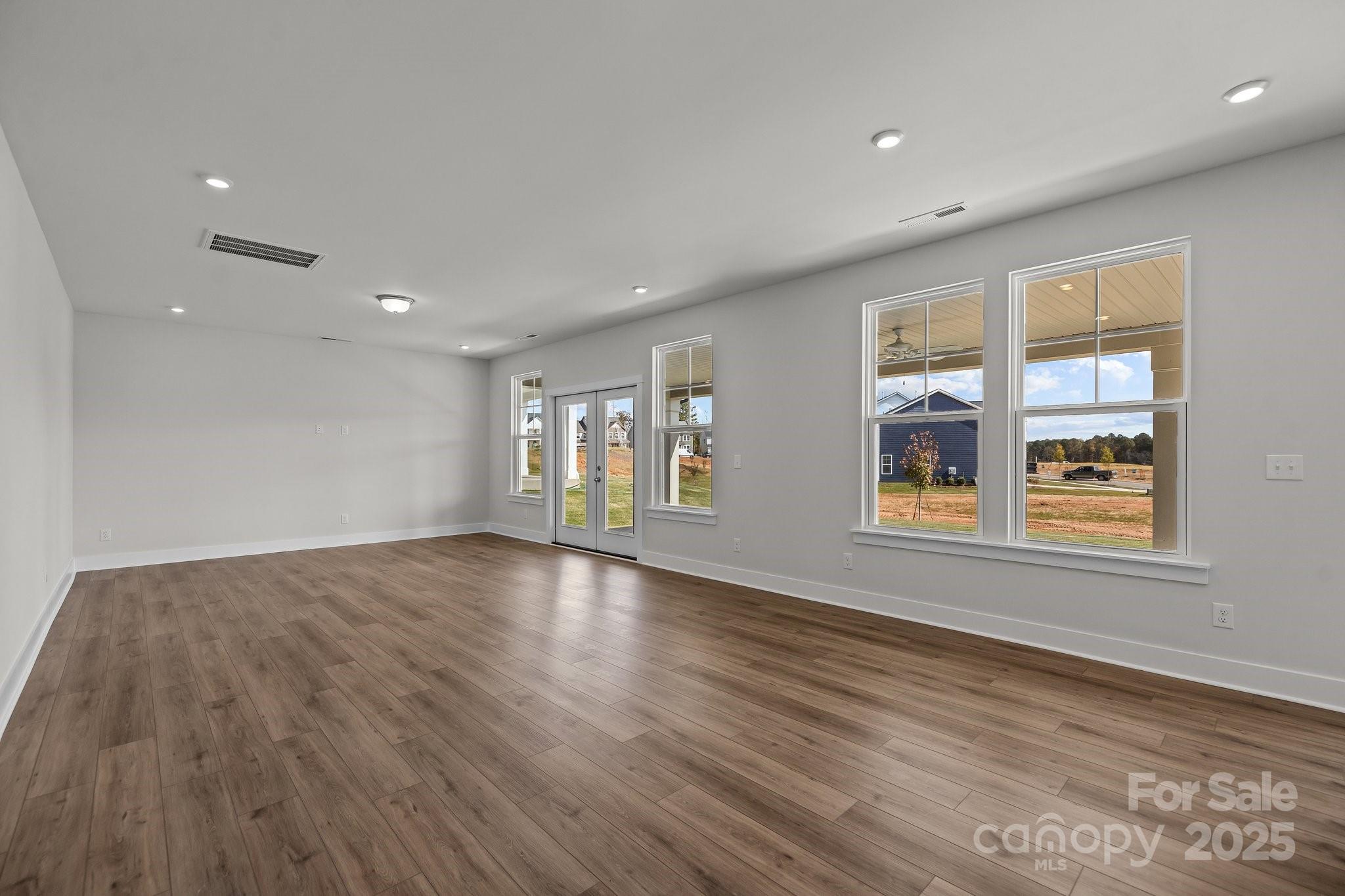 733 Sirius Lane, Unit 92 York, SC 29745 - Photo 3 of 18 a view of empty room with wooden floor and fan