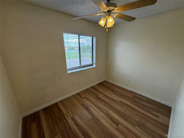 a kitchen with a white stove top oven and sink