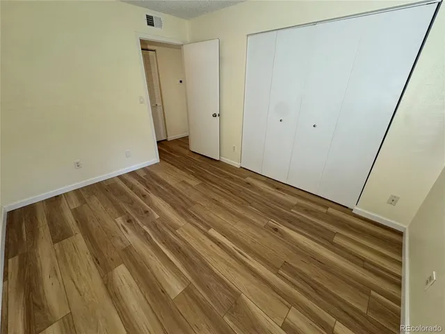 a bathroom with a sink mirror vanity and toilet